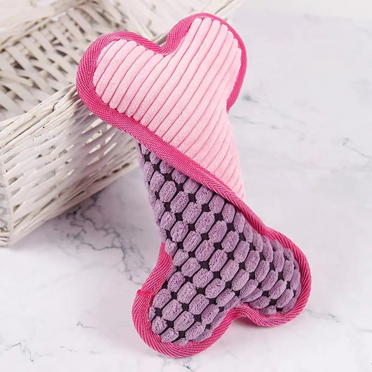 Présentation de peluche rose pour chien en os (FlexibleBone™) Palais Canin